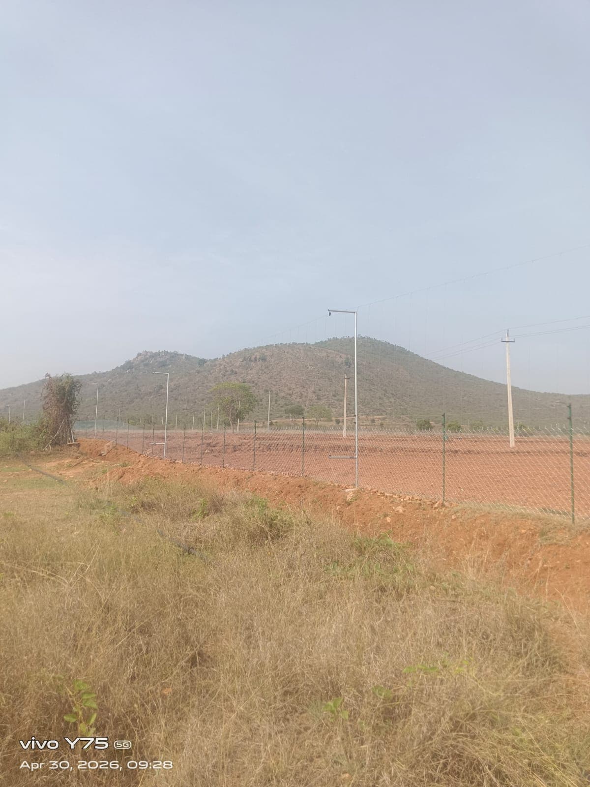 Long solar fence perimeter protecting an industrial plot