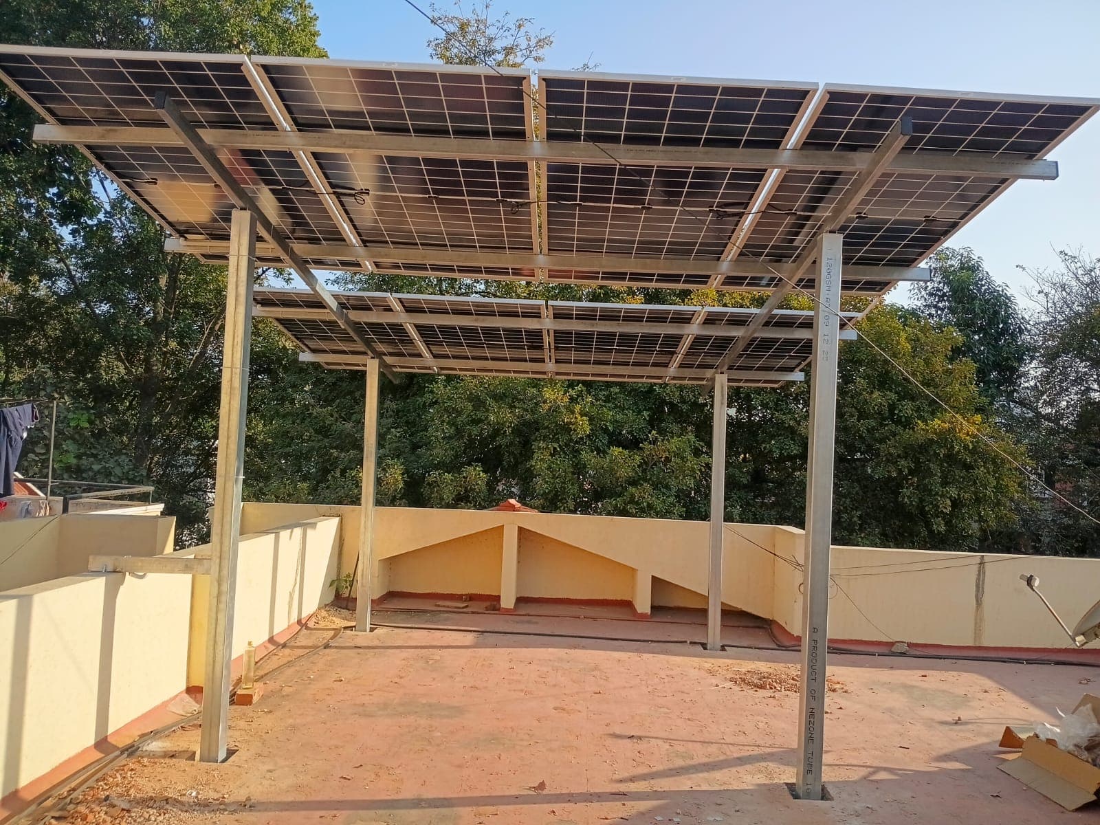 Elevated rooftop solar structure keeping the terrace usable below