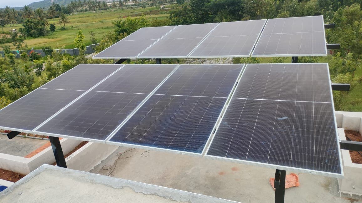 Elevated solar panels installed at a farmhouse