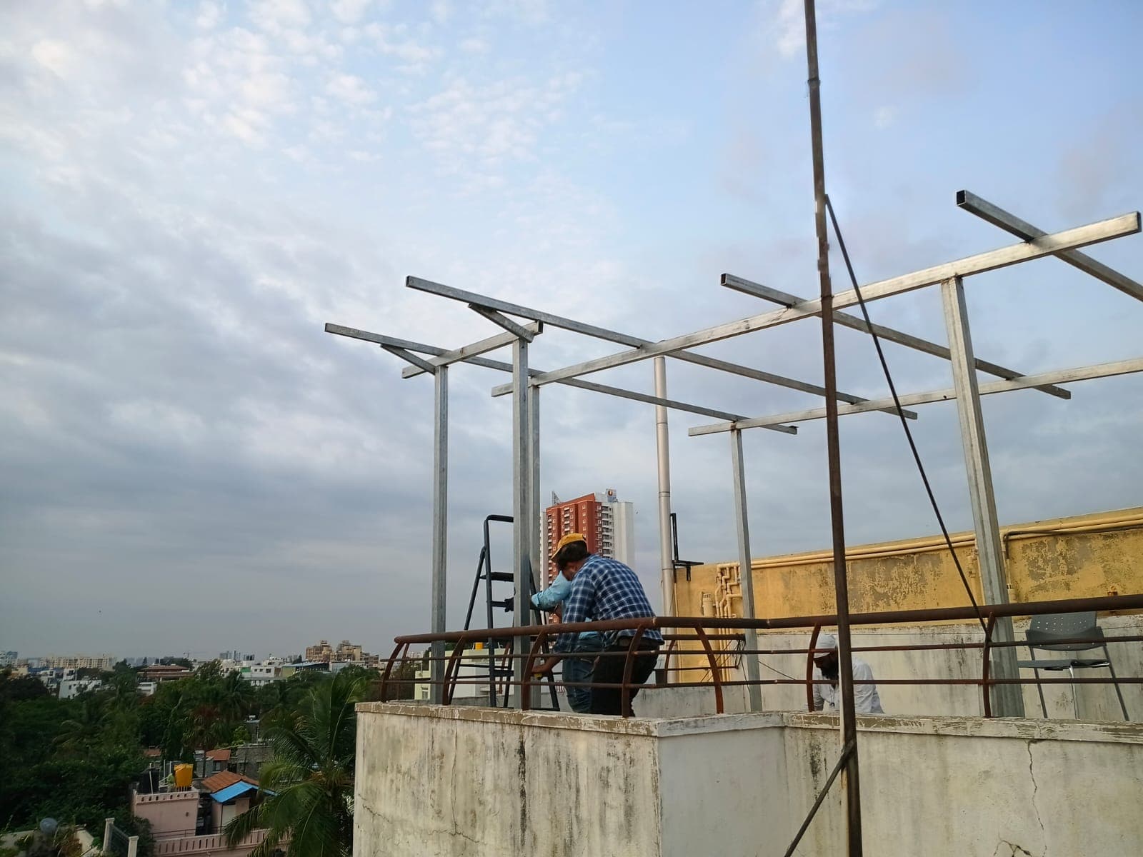 HiTech crew erecting a galvanized rooftop solar structure